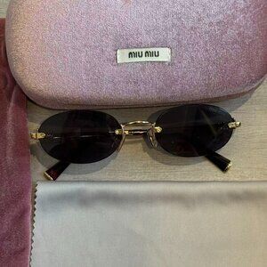 Miu Miu Black Lens Gold Rim Oval Sunglasses